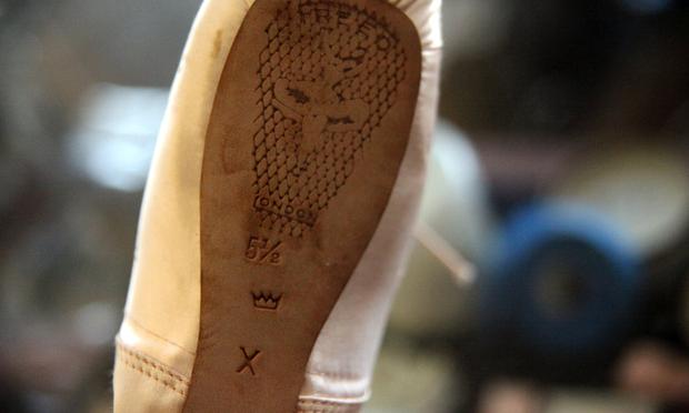A ballet shoe with the 'crown' stamp.
