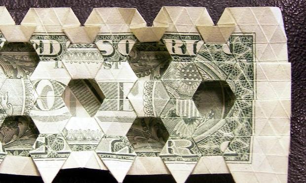 The federal deficit will rise close to $1.5 trillion in 2010; the government will borrow 41 cents of every dollar it spends. folded dollar holes