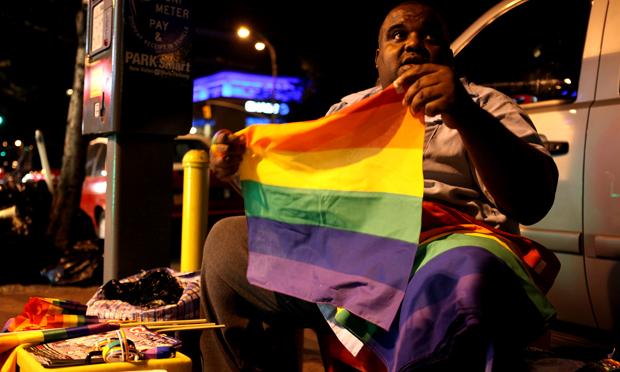 Hundreds gather outside of the Stonewall Inn to celebrate the passage of a same-sex marriage bill.
