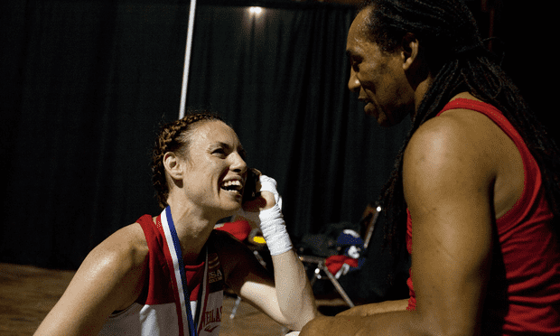 Heather Hardy with her coach, Devon Cormack, after winning the featherweight championship at Nationals.
