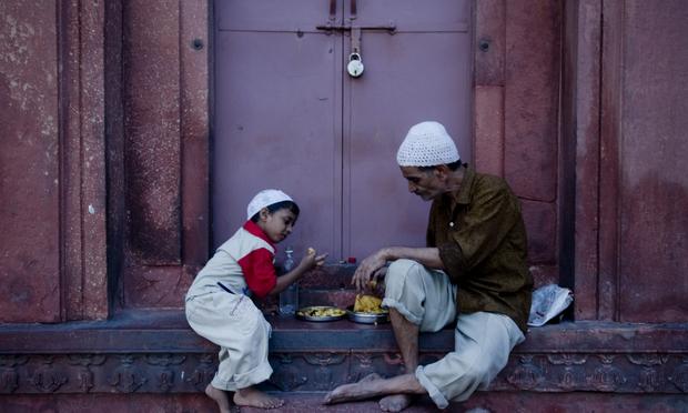 An Indian Muslim man and child break their fast on the first day of Ramadan at Jama Masjid mosque in New Delhi on August 12, 2010. An Indian Muslim man and child break their fast on the first day of Ramadan at Jama Masjid mosque in New Delhi on August 12, 2010.