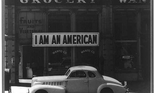 Oakland, Calif., Mar. 1942. A large sign reading 'I am an American' placed in the window of a store on December 8, the day after Pearl Harbor. Oakland, Calif., Mar. 1942. A large sign reading 'I am an American' placed in the window of a store, at 13th and Franklin streets, on December 8, the day after Pearl Harbor.