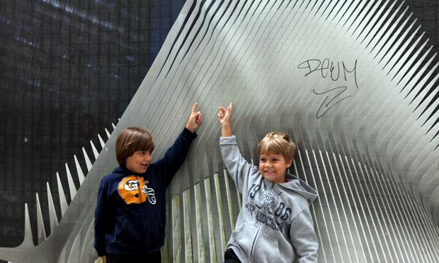 Parents brought their children down to Ground Zero to see the construction and the site of the 9/11 attacks. Parents brought their children down to Ground Zero to see the construction and the site of the 9/11 attacks.