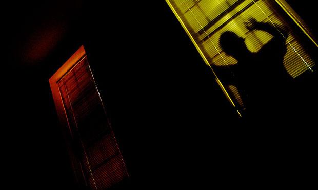 Man lurking at window