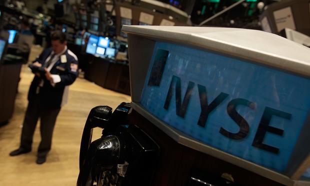 A financial professional works on the floor of the New York Stock Exchange near the end of the trading day May 20, 2010 in New York City.