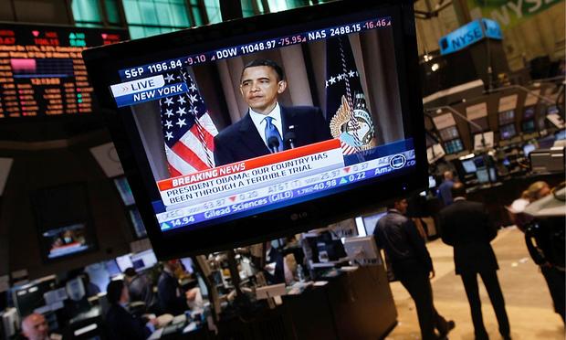 President Obama appears on a television screen over the floor of the New York Stock Exchange at midday as he gives a speech about Wall Street financial reform in Lower Manhattan.