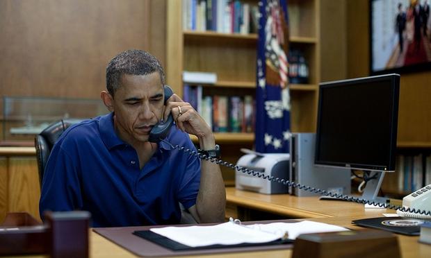 President Barack Obama is briefed while at Camp David, August 6, 2011.