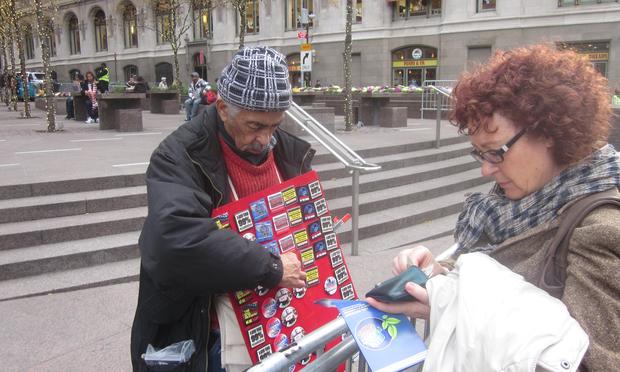 Selling OWS buttons for $2 apiece.
