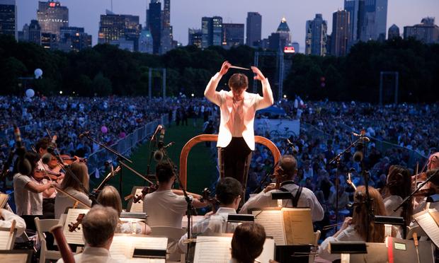 The New York Philharmonic play in Central Park The New York Philharmonic play in Central Park