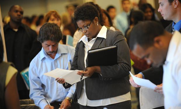 Job seekers look for employment at a job fair in Los Angeles on September 20, 2010 Job seekers look for employment at a job fair in Los Angeles on September 20, 2010