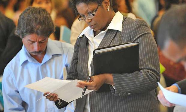 Job seekers look for employment at a job fair in Los Angeles on September 20, 2010 Job seekers look for employment at a job fair in Los Angeles on September 20, 2010