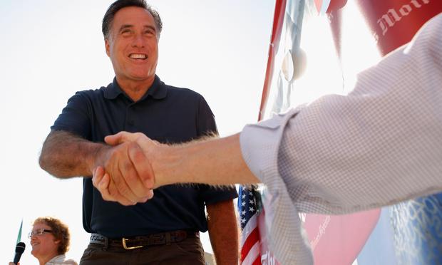 Republican presidential candidate Mitt Romney introduces himself to voters at the Iowa State Fair August 11, 2011 in Des Moines, Iowa.