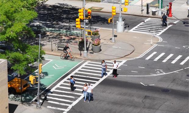 A 'complete street' with space marked not only for vehicles but pedestrians and bikes.