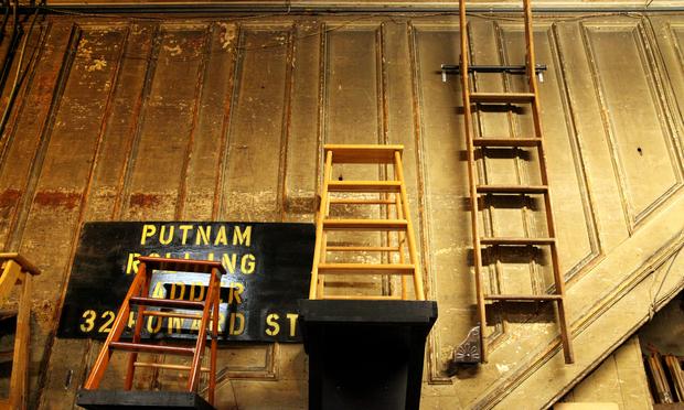 A Putnam Rolling Ladder mounted on the wall.
