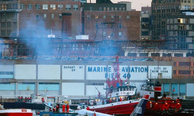 NEW YORK - JANUARY 15: Rescue workers in boats assist a US Airways plane (R) floating in the water. (Photo by Mario Tama/Getty Images) NEW YORK - JANUARY 15: Rescue workers in boats assist a US Airways plane (R) floating in the water. (Photo by Mario Tama/Getty Images)