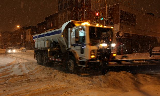 Snow plows blasting down Grand Street early Wednesday morning in Williamsburg