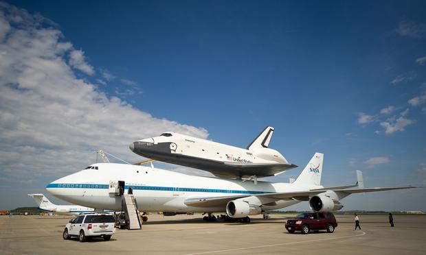The space shuttle Enterprise is seen mated on top of the NASA’s Shuttle Carrier Aircraft (SCA), a modified Boeing 747 jumbo jet, at Washington Dulles International Airport on Saturday, April 21, 2012.