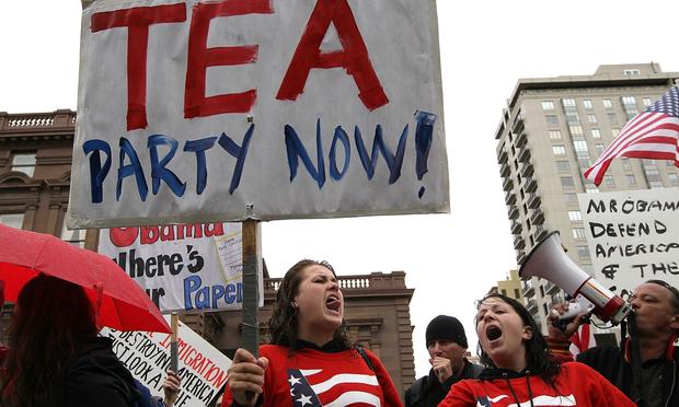 Members of the Tea Party movement protest outside the Fairmont Hotel before President Obama arrives for a fundraiser May 25, 2010