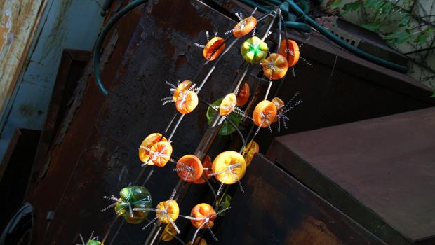 The centerpiece on the Voodoo Lily is repurposed plastic bottles and metal springs.
