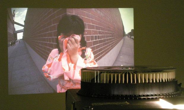 This work, 'Walking Piece,' includes photographs of Kusama walking the streets of New York City in a pink kimono. This work, 'Walking Piece,' includes photographs of Kusama walking the streets of New York City in a pink kimono.