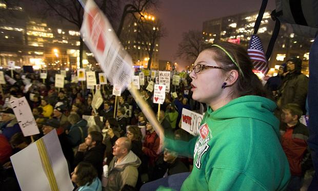 College student Heather Roberts joins protesters who filled the steps and grounds surrounding the State Capitol building on February 16, 2010 in Madison, Wisconsin.