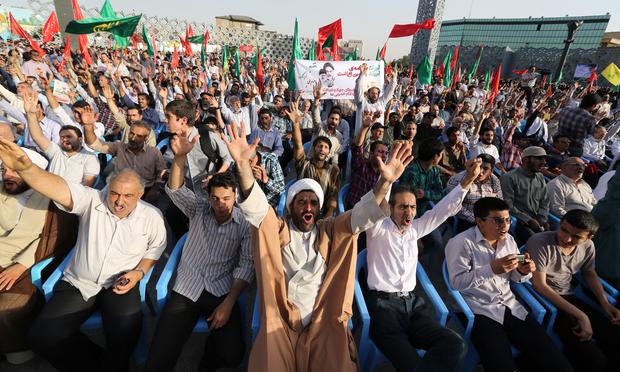 Iranians shout slogans during a protest against the Sunni Arab militants offensive led by the jihadist Islamic State of Iraq and the Levant (ISIL) in Iraq on June 24, 2014 in Tehran.
