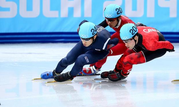 Han-Bin Lee of South Korea, Dequan Chen of China and Michael Gilday of Canada compete in Short Track Speed Skating on day 3 of the Sochi 2014 Winter Olympics.