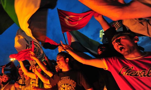 Demonstrators shout slogans in front of the Israeli consulate during a protest against Israel in Istanbul ,on June 1, 2010. Angry demonstrations continued across Turkey for a second day Tuesday.