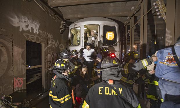 Emergency service workers responded to the derailment of an F train under Broadway and 60th Street in Woodside, Queens, on May 2, 2014. Emergency service workers responded to the derailment of an F train under Broadway and 60th Street in Woodside, Queens, on May 2, 2014.