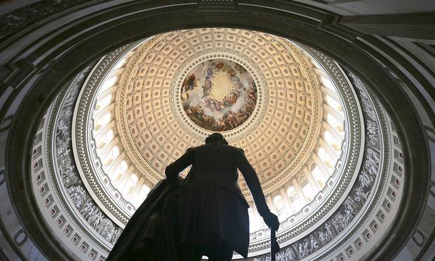 A statue of George Washington stands in the Rotunda of the U.S. Capitol August 28, 2012 on Capitol Hill in Washington, DC. It has been reported that the dome of the Capitol has 1,300 known cracks.