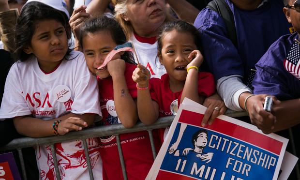 L to R: Lia Lopez, 8, Ashley Flamenco, 7, and Lynsey Lopez, 5 attend a rally in support of immigration reform, in Washington, on October 8, 2013 in Washington, DC.