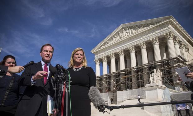 Michigan Attorney General Bill Schuette (L) speaks during a press conference after going before the Supreme Court in 'Schuette v. Coalition to Defend Affirmative Action.' Oct. 15, 2013