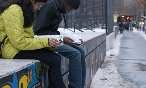 Students study in the cold outside Stuyvesant High School in Manhattan. Students study in the cold outside Stuyvesant High School in Manhattan.