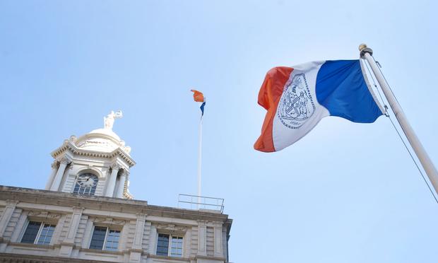 The New York City flag flies outside New York City Hall. The New York City flag flies outside New York City Hall.