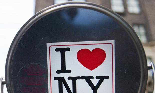 An 'I heart NY' sticker on a vendor's mirror near Central Park. An 'I heart NY' sticker on a vendor's mirror near Central Park.