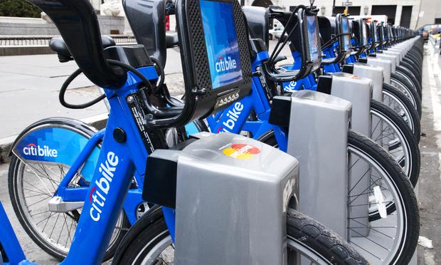 Citibikes parked in front of The Apple Store in midtown Manhattan.