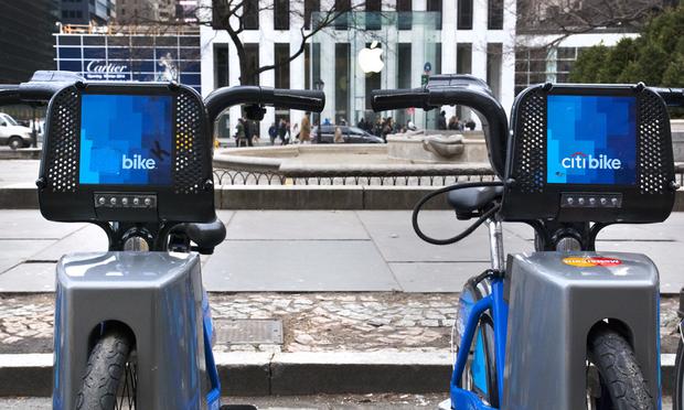 Citibikes parked in front of The Apple Store in midtown Manhattan.