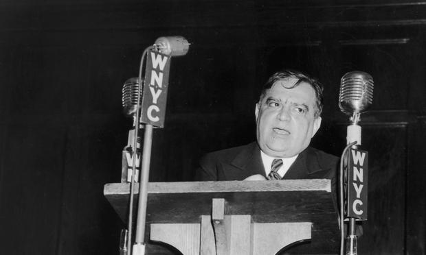 New York City mayor Fiorello La Guardia in 1943 makes a dedication speech from a podium at the opening of the Fort Green Housing Development for war workers, Brooklyn.