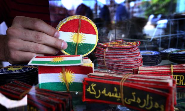 An Iraqi man displays military badges at a shop in Arbil, the capital of the autonomous Kurdish region of northern Iraq.