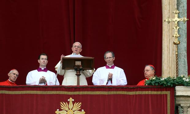 Pope Francis delivers his Christmas Day message from the central balcony of St Peter's Basilica on December 25, 2013 in Vatican City, Vatican. Pope Francis delivers his Christmas Day message from the central balcony of St Peter's Basilica on December 25, 2013 in Vatican City, Vatican.