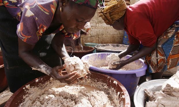 Women from a cooperative in Ouagadougou, Burkina Faso prepare butter for use in cosmetics exporter to Europe and the United States.