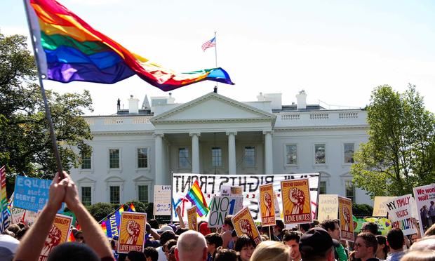 Tens of thousands of gay activists marched to demand civil rights on October 11, 2009 , a day after President Barack Obama vowed to repeal a ban on gays serving openly in the US military.