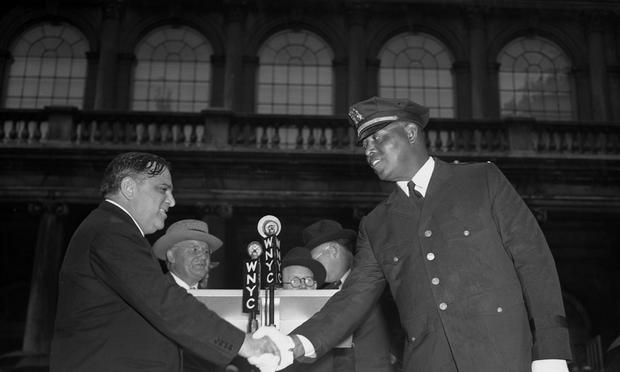 Sept 4, 1941: Mayor LaGuardia appointing Lt. Samuel J. Battle as member of Parole Commission. Police Commissioner Louis Valentine is center.