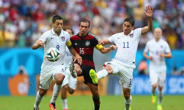 Philipp Lahm of Germany is challenged by Clint Dempsey (L) and Alejandro Bedoya of the U.S. during the 2014 FIFA World Cup Brazil group G match at Arena Pernambuco on June 26, 2014 in Recife, Brazil. Philipp Lahm of Germany is challenged by Clint Dempsey (L) and Alejandro Bedoya of the U.S. during the 2014 FIFA World Cup Brazil group G match at Arena Pernambuco on June 26, 2014 in Recife, Brazil.