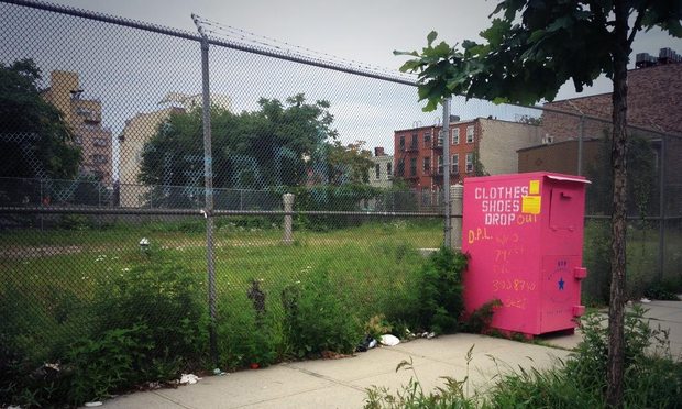 A clothing donation drop-off bin in Bed-Stuyvesant. Many of these bins are run by companies that actually re-sell the items, rather than donate them to charity.