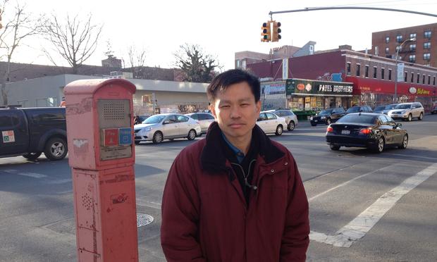 Hsi-Pei Liao at an intersection in Flushing. Behind him is the street where his four-year-old daughter, Allison, was struck and killed by an SUV. Hsi-Pei Liao at an intersection in Flushing. Behind him is the street where his four-year-old daughter, Allison, was struck and killed by an SUV.