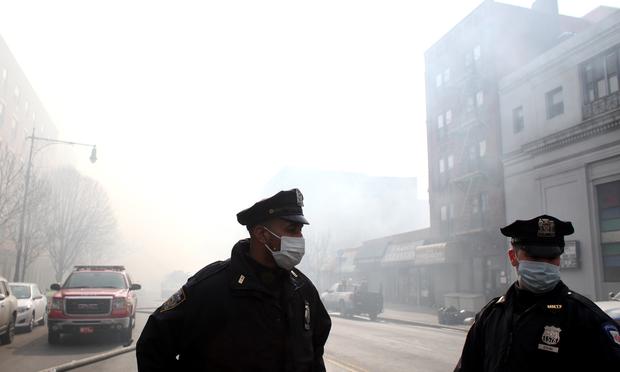 NYPD and hundreds of firefighters responded to a 5-alarm fire at the site of two building explosions in East Harlem on March 12, 2014. NYPD and hundreds of firefighters responded to a 5-alarm fire at the site of two building explosions in East Harlem on March 12, 2014.