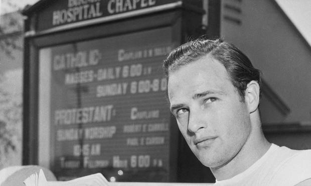 Marlon Brando reading Krishnamurti in front of a church. The books he read are among the many things that helped shape his performances. Marlon Brando reading.