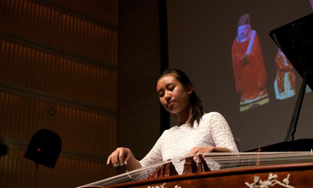 Guzheng player Rujia Teng performs 'The Eternal Sorrow of Lin'An' by Zhanhao He with projected artwork. Guzheng player Rujia Teng performs 'The Eternal Sorrow of Lin'An' by Zhanhao He with projected artwork.