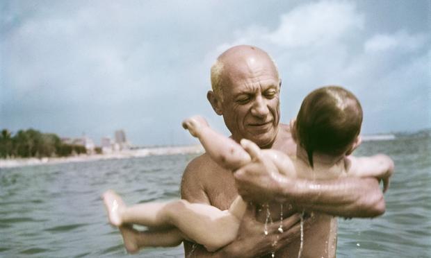 Pablo Picasso playing in the water with his son Claude, Vallauris, France, 1948